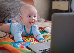 picture of baby looking at computer