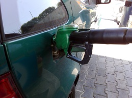 picture of car fueling up at gas pump